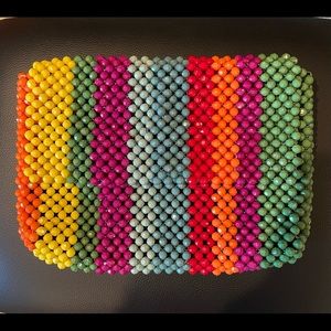 This is a beaded bag that’s medium size/no strap